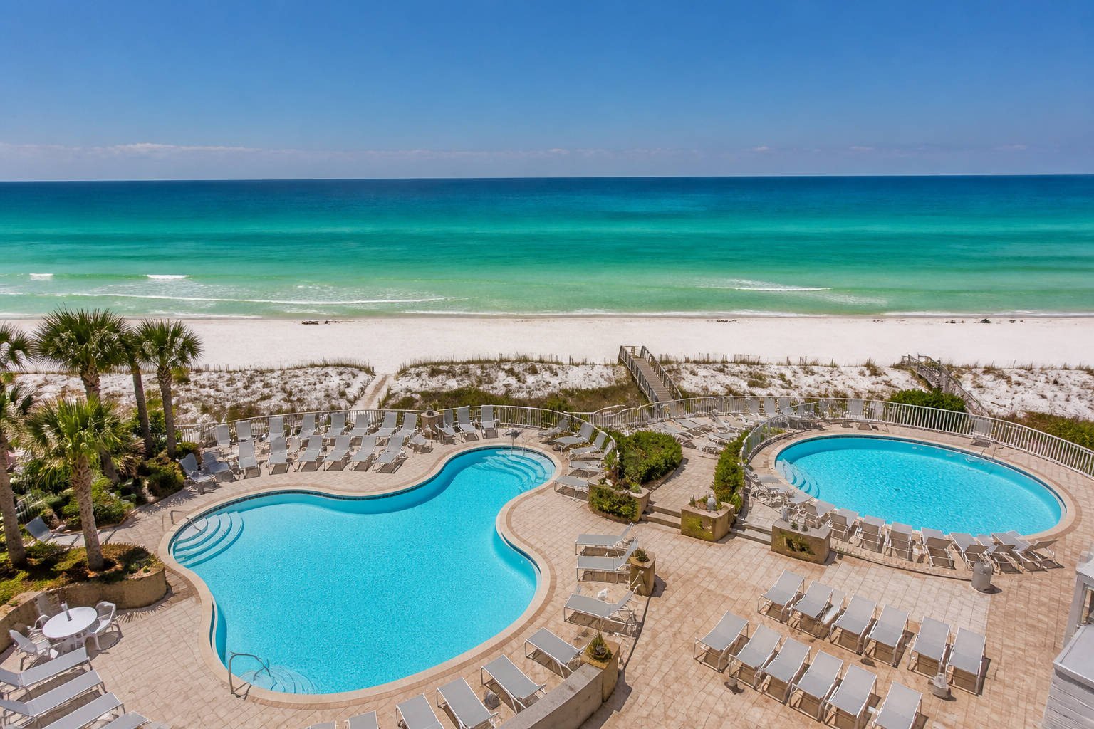 Top-rated hotel pool and beachfront view at a Fort Walton Beach Florida resort on the Emerald Coast